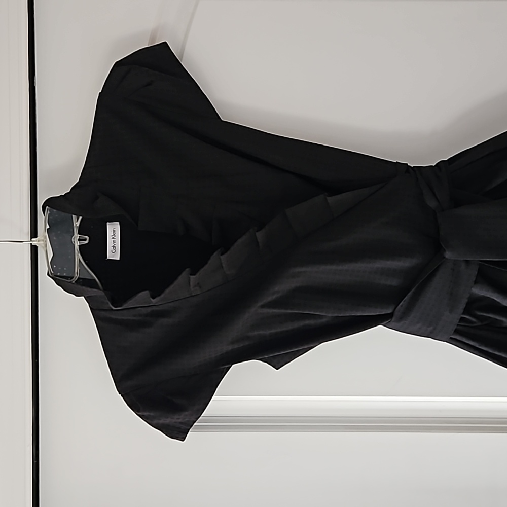 Ruffle collar, lined wrap dress.